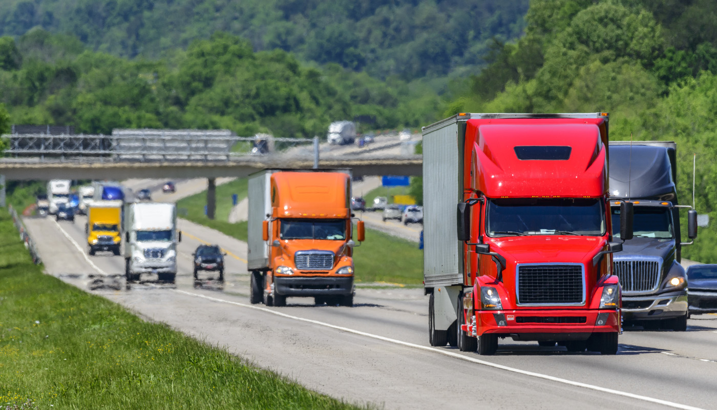 semi trucks rolling on a highway - carriers and independent truck drivers