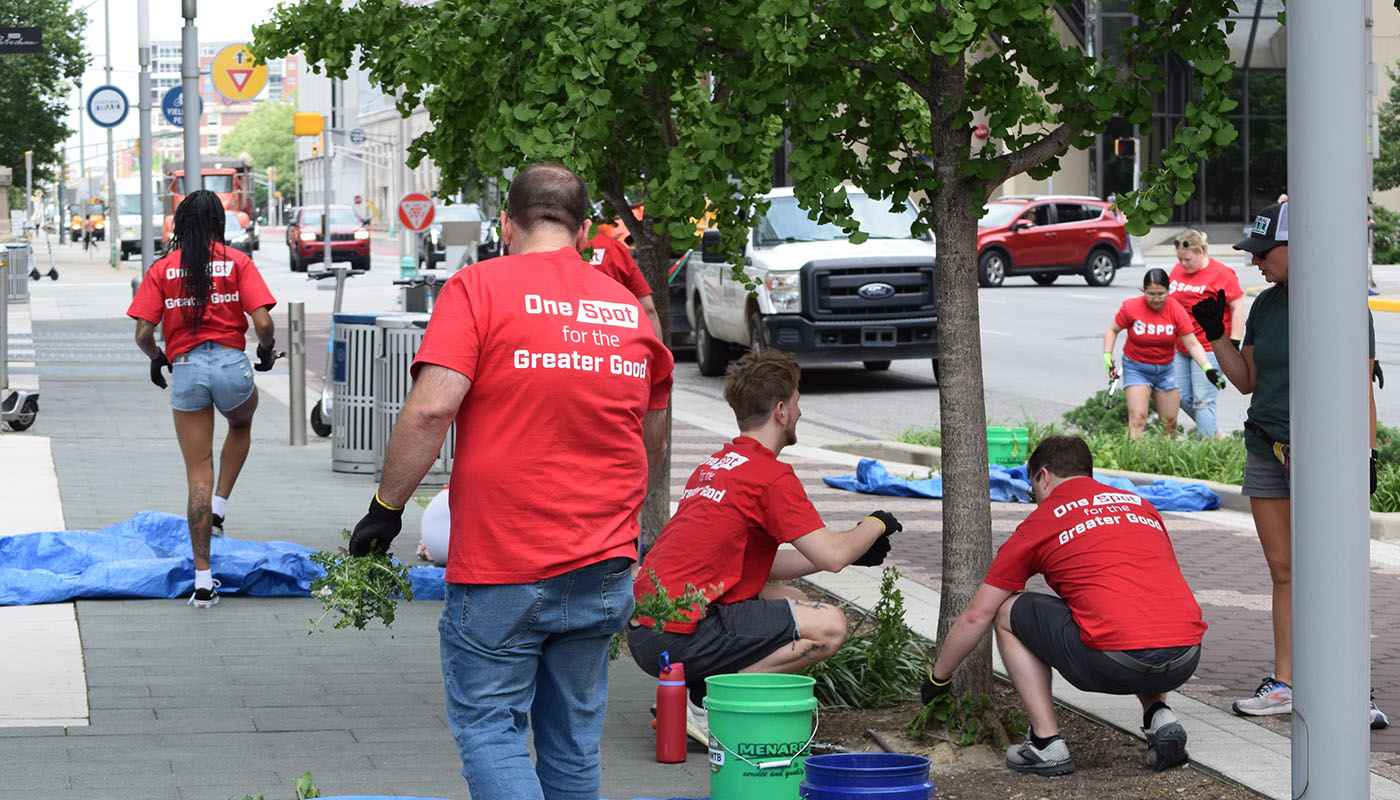 Spot employees working during a neighborhood cleanup effort in downtown Indianapolis