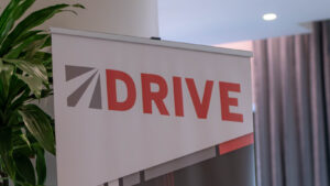 DRIVE logistics event banner displayed indoors, representing Spot’s DRIVE transportation and supply chain industry conference.