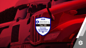 Close up of red trucks with award logo in the foreground